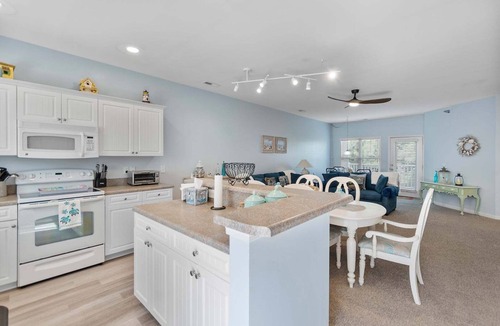Southport House | 4136 Vanessa Dr Unit 13: 3-bedroom condo in Southport with a private pool