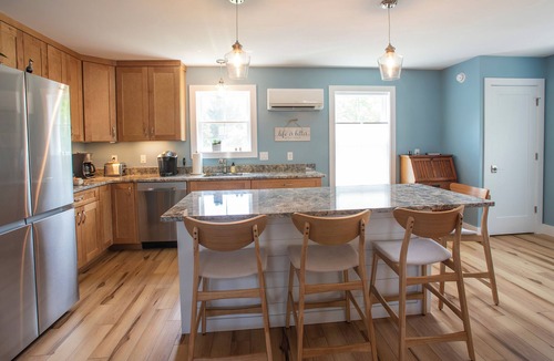 Milton Apartment | Town center, walk to popular amenities, short drive to local beaches.
